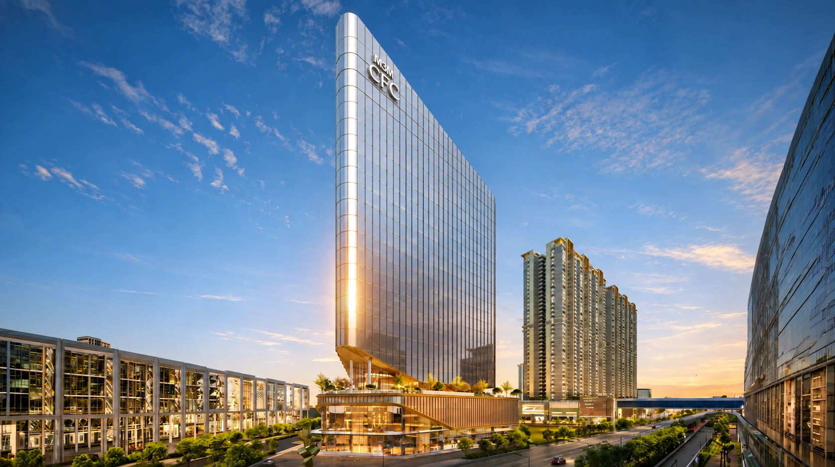 M3M CFC commercial tower in Sector 113 Gurgaon with modern glass façade, landscaped podium, surrounding high-rise buildings, and wide road at sunset.