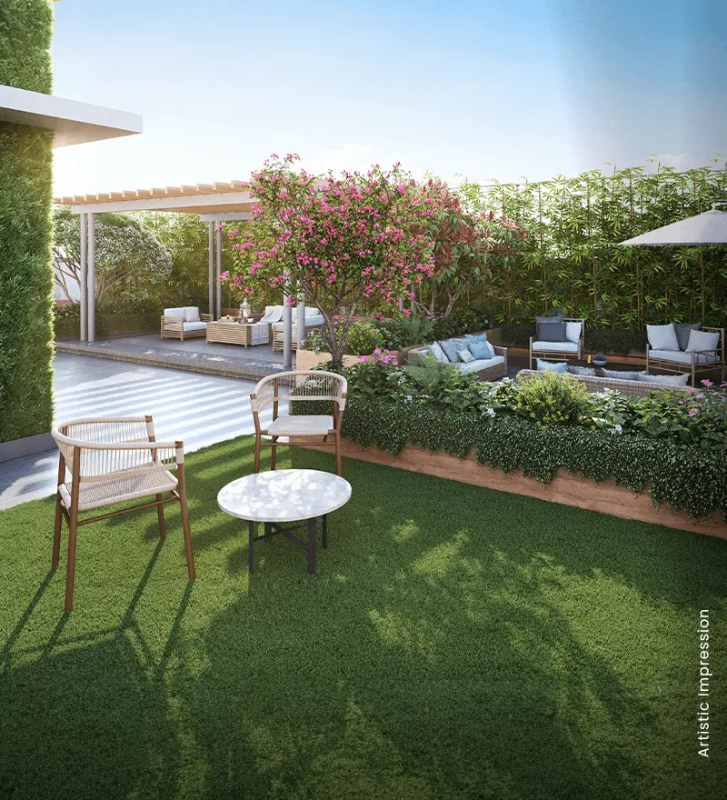 M3M Soulitude luxury landscaped garden with green chairs and outdoor seating in Sector 89 Gurgaon