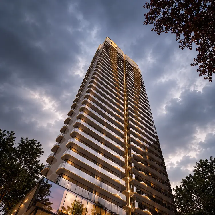 M3M Elie Saab Residences Gurgaon luxury high-rise tower with curved balconies and glass facade at sunset
